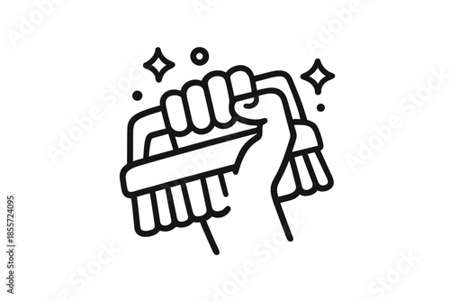 Hand holding a cleaning brush