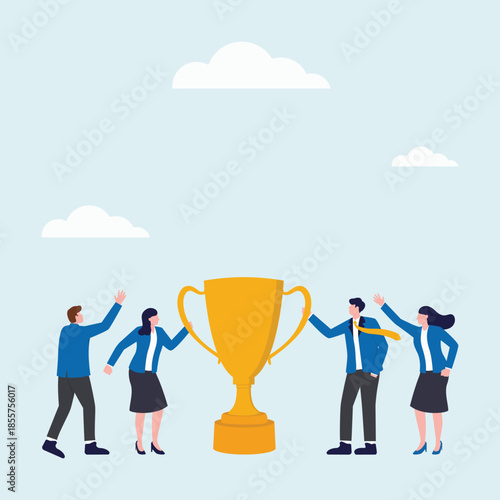 Group or team of people are holding a trophy and celebrating their victory