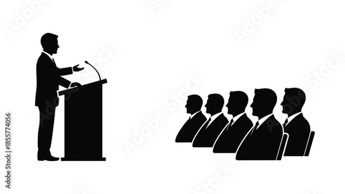 A speaker addressing an audience in a stark black silhouette
