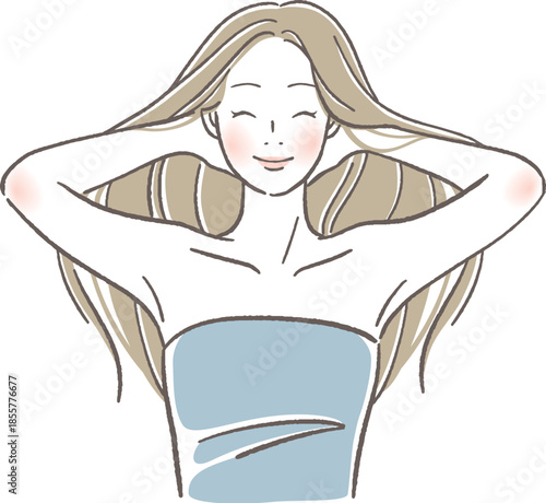 笑顔で髪をかきあげる女性