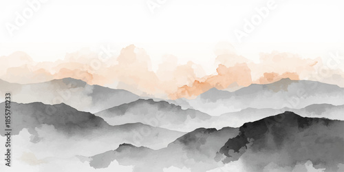 A high mountain peak emerges from the morning fog as sunlight breaks through clouds to reveal a misty blue valley landscape at sunset