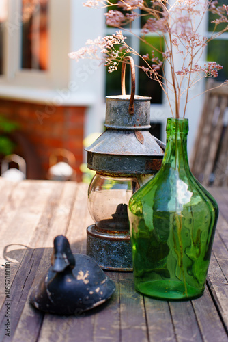 Decorative objects on wooden table at outdoor setting