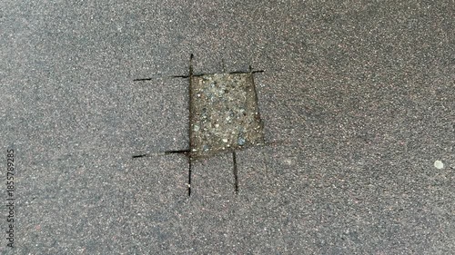 Place of selection of the kernel in the form of a rectangular from asphalt concrete pavement. Kern. Close-up
