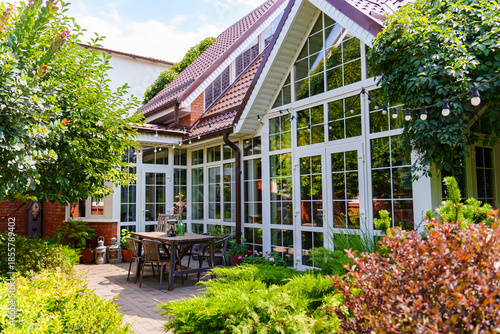Cozy outdoor space with plants and wooden table setup