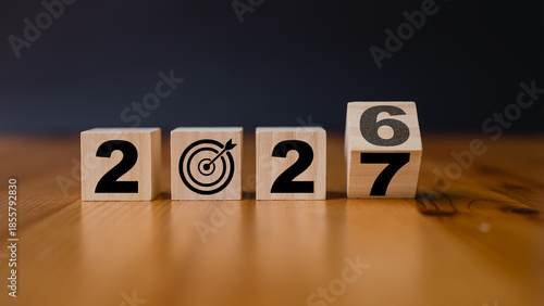 wooden cubes with the text 2026 2027 over background, 2027 goal plan target success future planning strategy achievement vision wooden blocks grass outdoors focus growth opportunity time