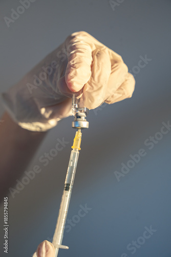 Medical worker administering an injection as part of routine healthcare