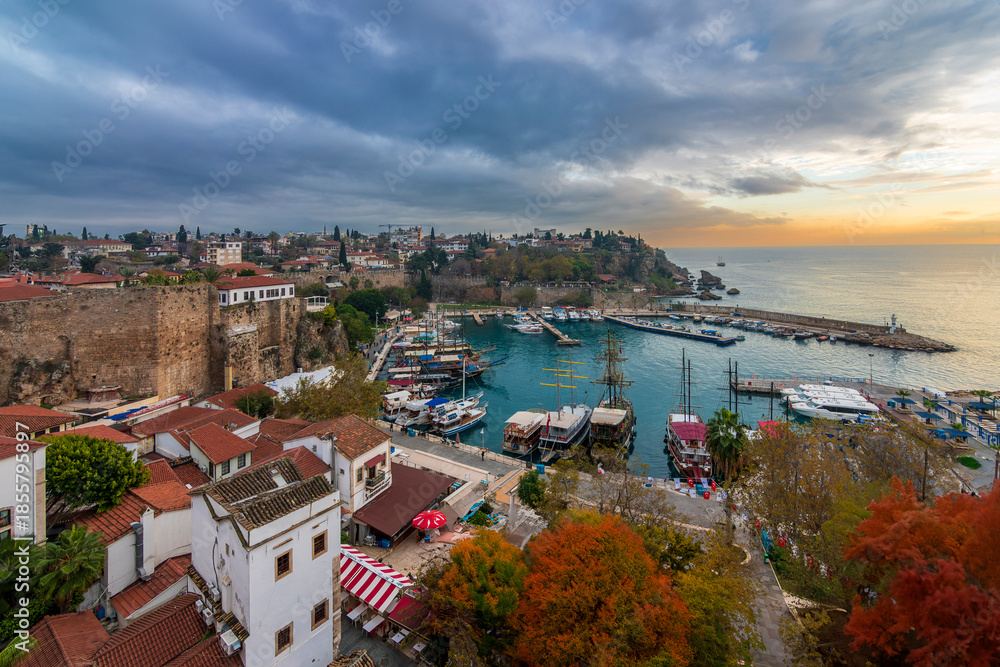 Fototapeta premium Ships in the old harbour in Antalya (Kaleici), Turkey. Old town of Antalya is a popular Tourist destination in Turkey.