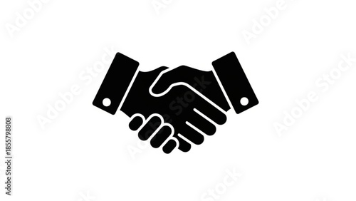 Two individuals shaking hands in a gesture of agreement or partnership