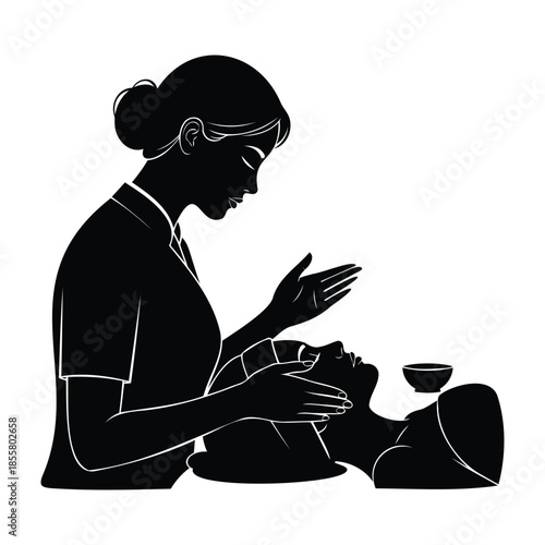 Silhouette of beautician giving facial massage to client