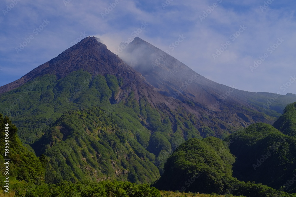 Fototapeta premium Mount Merapi or Gunung Merapi is an active stratovolcano located on the border between Central Java and Yogyakarta provinces, Indonesian.