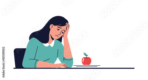 Sad and tired young woman sits at a desk with her head in her hand feeling depressed and overwhelmed by her problems.