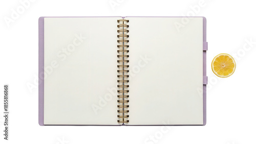 Isolated notebook with rings and blank paper pages for text plus lemon half in studio light