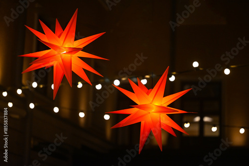 Glowing Christmas stars on a dark background