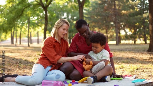 Multiracial family enjoying a picnic in the park