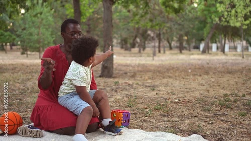 African mother and son enjoying a relaxing day at the park