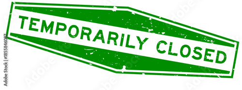 Grunge green temporily closed word hexagon rubber seal stamp on white background