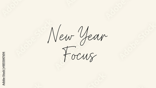 A minimalist typography design featuring New Year Focus text on a plain background viewed from directly above