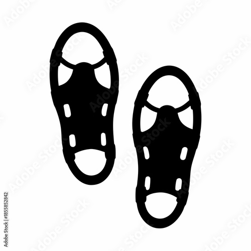 Silhouette of two snowshoes, winter footwear equipment for walking in snow