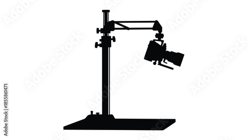 Silhouette of a studio lighting stand with adjustable arm and lamp isolated on white background