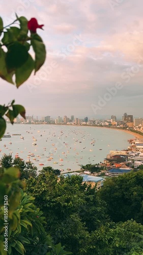 The Gulf of Thailand at sunset. View from the observation deck at sunset on Khao Phra Hill, Pratamnak in Pattaya: central beach, waterfront, boats, ferries, and yachts on the turquoise water. Thailand