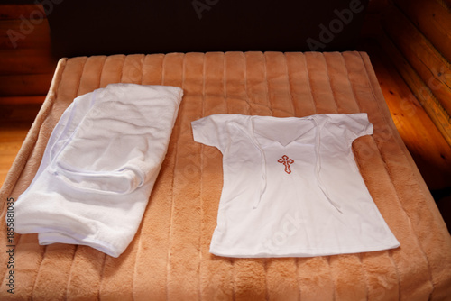 Clean clothes laid out on bed in cozy room