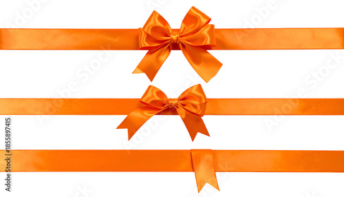 Vivid orange satin ribbons, two bows, against a black background