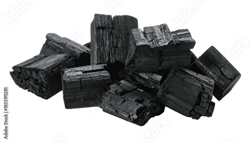 Pile of dark, irregular charcoal briquettes, showing texture and varying sizes