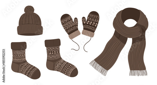 Set of cozy brown knitted winter accessories with a nordic pattern including a hat scarf mittens and a pair of warm socks.