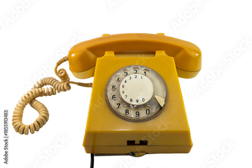 Old, used , scratched analog rotary telephone isolated on white background