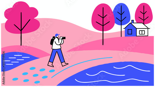 Traveler photographer walking by river in colorful landscape