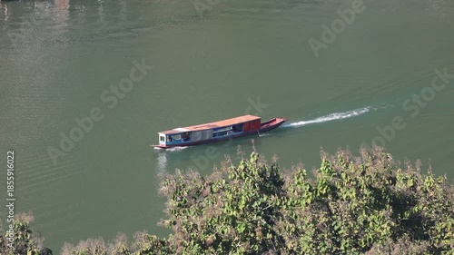  transport boats travel along the river water near the dock pier