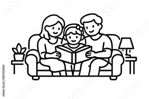Family reading a book together on a couch