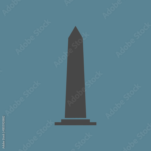 Dark grey obelisk monument with a pointed top and tiered base.