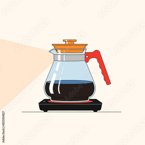 Elegant glass carafe filled with dark beverage warming on modern induction cooktop appliance