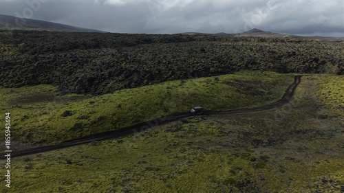 ATV Driving through Moss Covered Lava Fields Iceland Aerial View