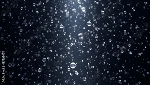 Raindrop Symphony: The scene captures the beauty of rain, a multitude of individual water droplets suspended in the air. Each glistening sphere tells a story of the dance between sky and earth.