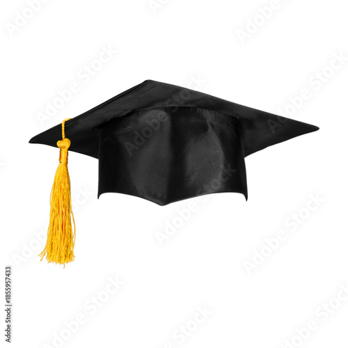 A black academic mortarboard graduation cap with a golden tassel rests atop a rolled diploma to celebrate the success and achievement of a university student at their college degree ceremony