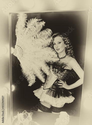 black and white color photo Beauty blonde hair retro lady looking into mirror hand holding fan natural ostrich feathers. sexy woman burlesque show actress. Flapper girl 20s roaring twenties old style