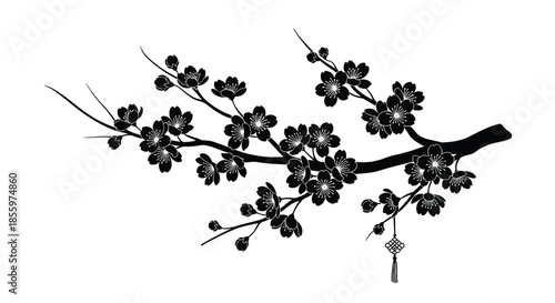 An elegant black silhouette of a blooming cherry blossom branch with a traditional tassel hanging from one of the twigs.