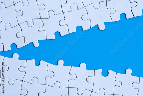concept of connection or gap with split jigsaw puzzle 