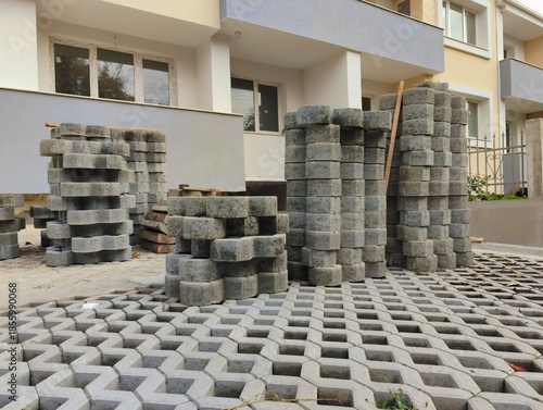photo of pile of concrete openwork panel pattern diamond shaped paving slab holes of paving cement brick block background hd high quality backdrop