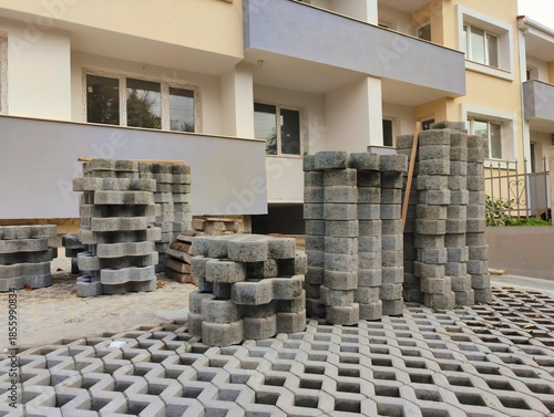 photo of pile of concrete openwork panel pattern diamond shaped paving slab holes of paving cement brick block background hd high quality backdrop
