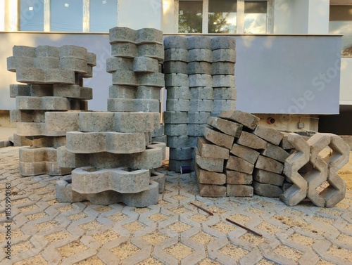 photo of pile of concrete openwork panel pattern diamond shaped paving slab holes of paving cement brick block background hd high quality backdrop