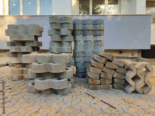 photo of pile of concrete openwork panel pattern diamond shaped paving slab holes of paving cement brick block background hd high quality backdrop