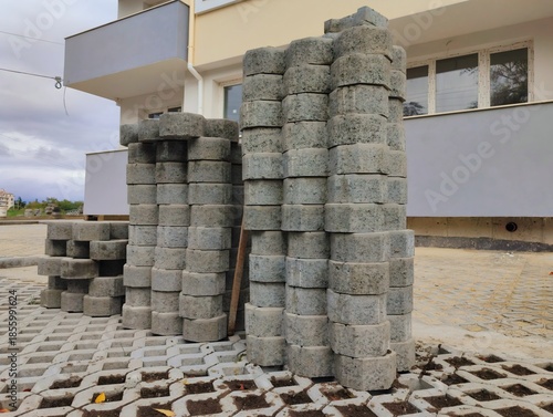 photo of pile of concrete openwork panel pattern diamond shaped paving slab holes of paving cement brick block background hd high quality backdrop