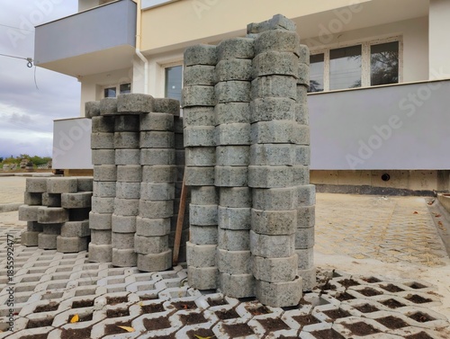 photo of pile of concrete openwork panel pattern diamond shaped paving slab holes of paving cement brick block background hd high quality backdrop