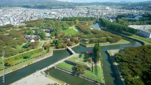High angle view of Hakodate city from Goryokaku Tower. It shows the star shaped fort and the Tsugaru Strait during autumn in Hokkaido Japan.