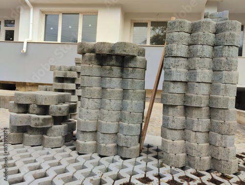 photo of pile of concrete openwork panel pattern diamond shaped paving slab holes of paving cement brick block background hd high quality backdrop