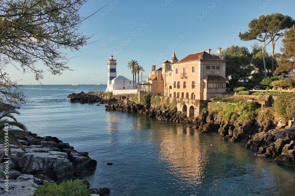 Obraz premium Santa Marta Beach in Cascais, Portugal. The Santa Marta lighthouse and lighthouse museum. Also pictured is the Santa Maria House Museum.