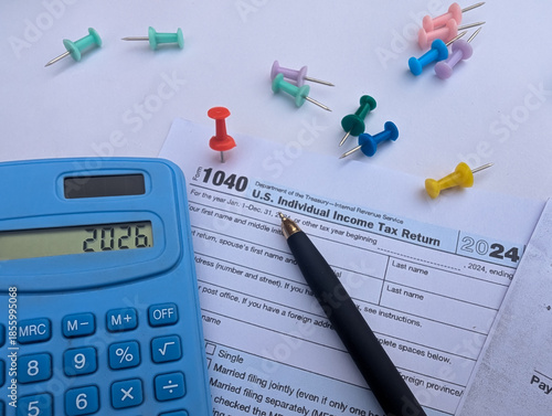 Fotografija tax 2026 with irs form 1040, calculator, pen, and push pins